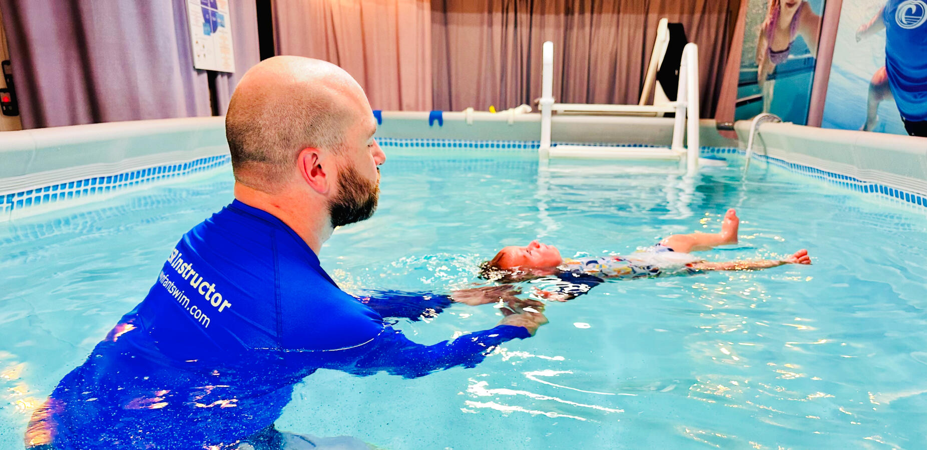 Infant floating in a pool