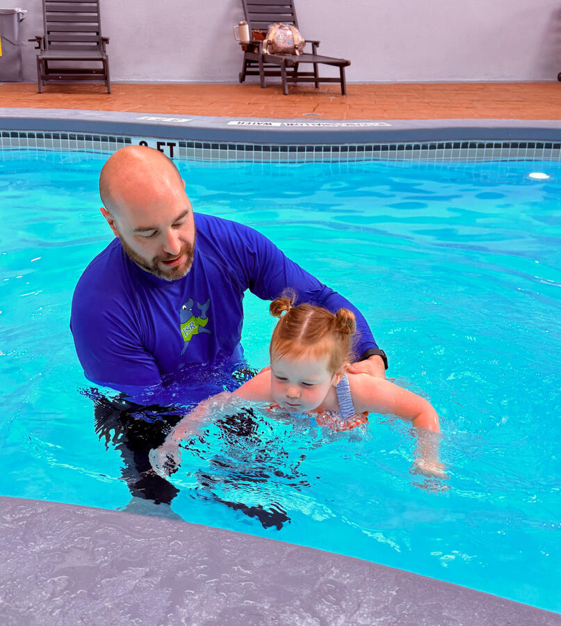 Child swimming in a pool Child swimming in a pool